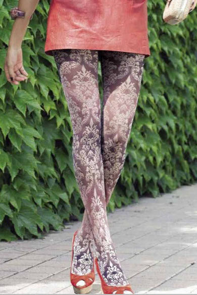 Lady's legs in white floral tights and red pumps.