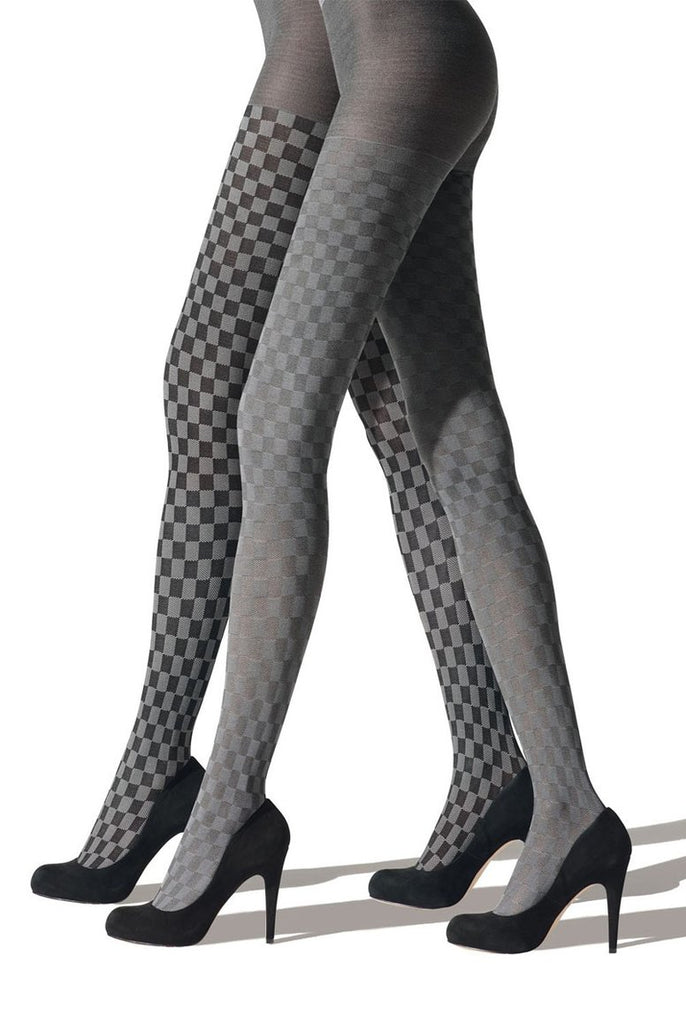 Side view of lady's legs striding in black and grey check pattern tights.