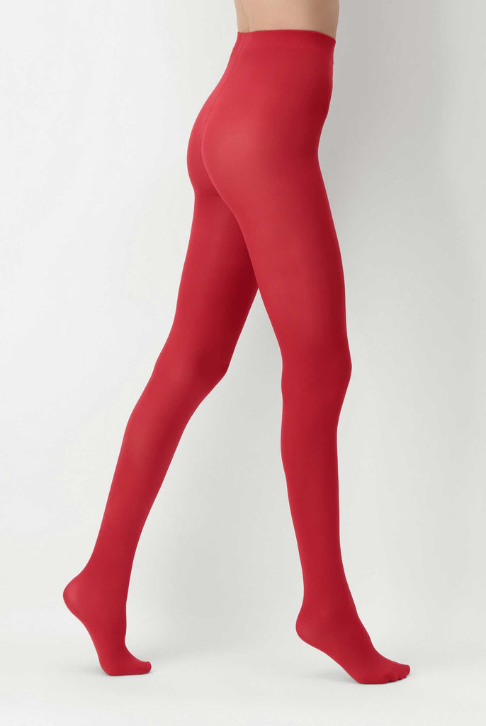 Side view of lady's legs walking and wearing red tights.