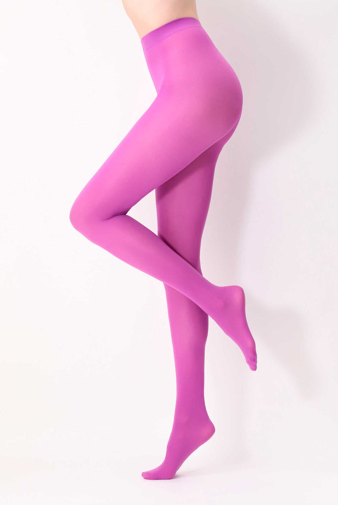Side view of lady's legs, standing and wearing dark lilac tights.