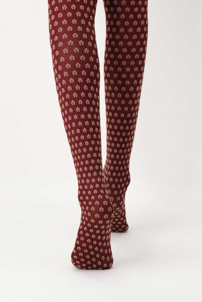 Back view of lady's legs wearing dark red floral tights.