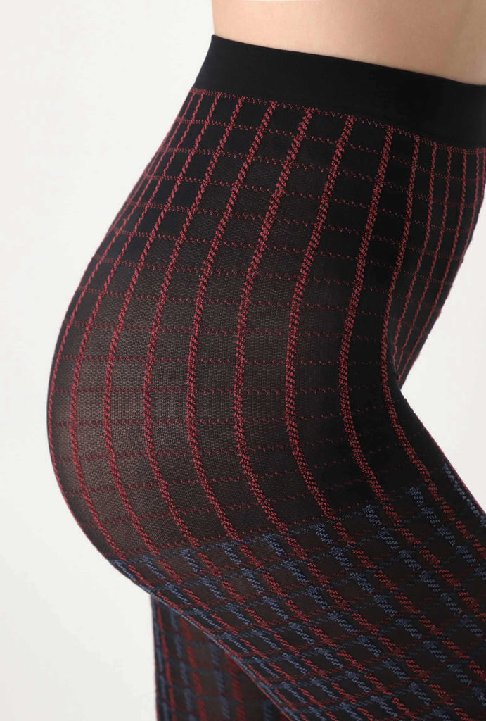 Side view of lady's abdomen, wearing check plaid tights.