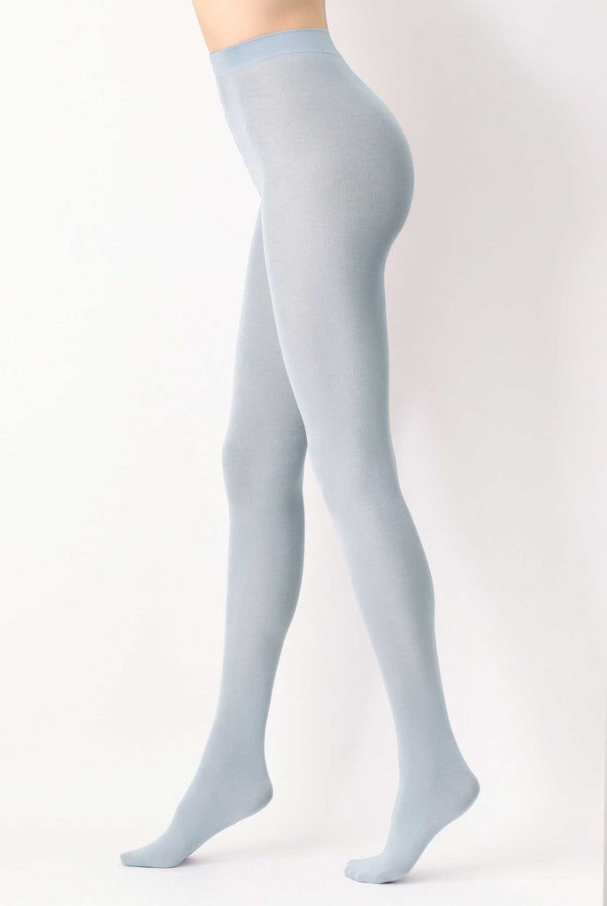 Side view of lady's legs in walking stance, wearing crystal blue tights.