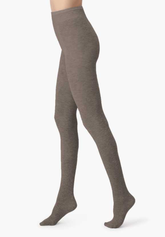 Side view of lady's legs wearing toffee coloured tights.