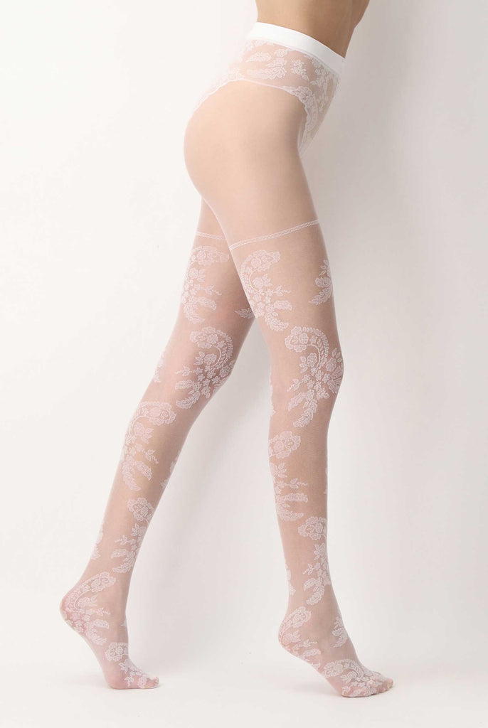 Side view of lady's legs in sheer white paisley patterned tights.