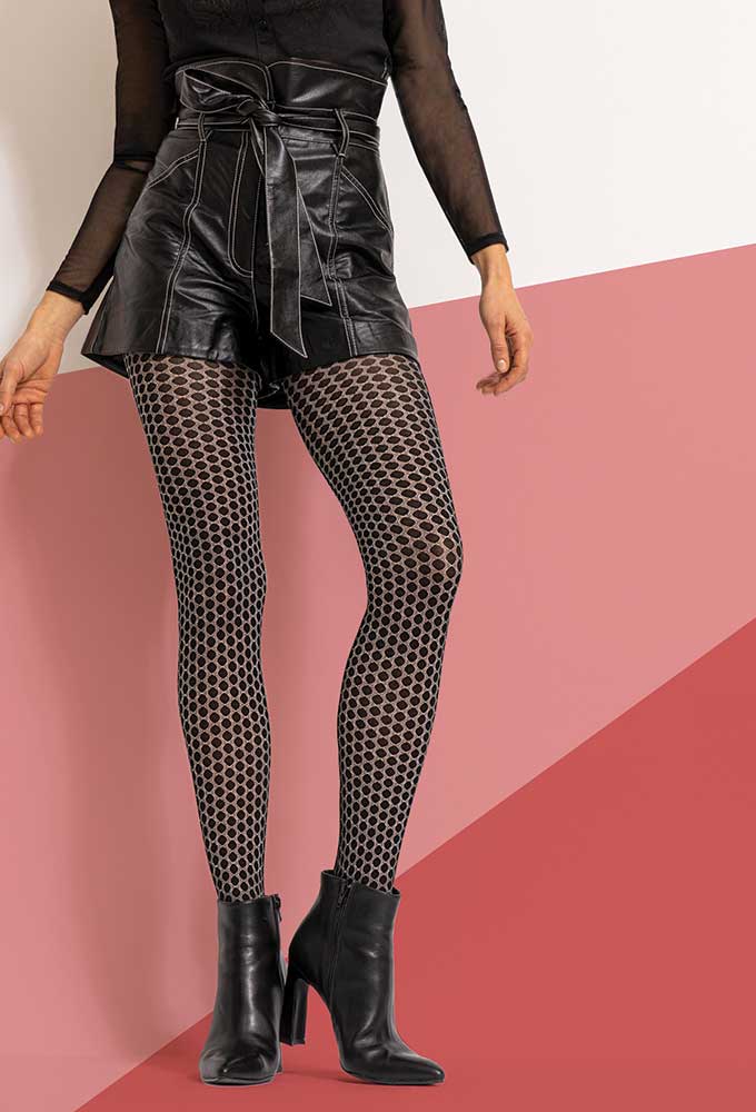 Front view of lady's legs wearing polka dot tights.