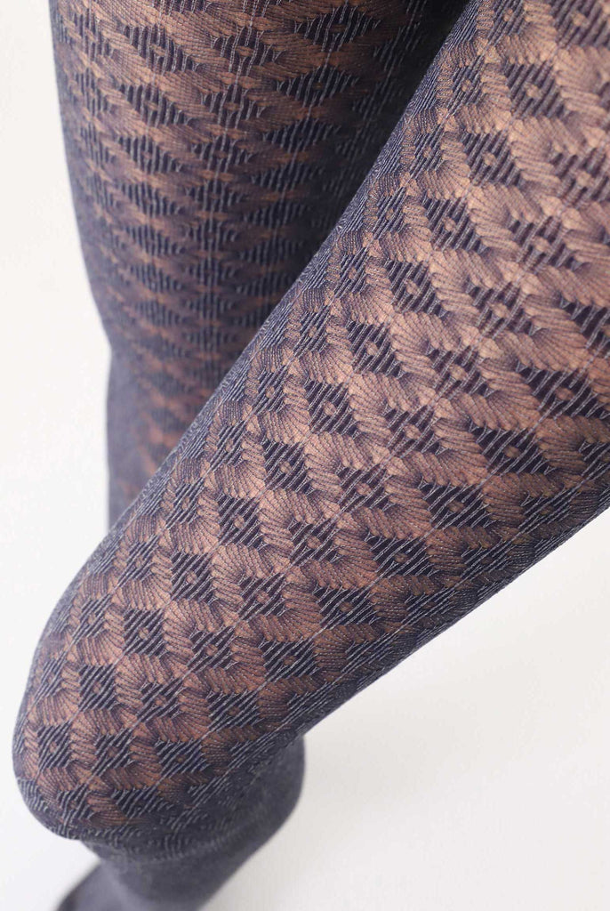 Close up of lady's upper thighs wearing crochet patterned tights.