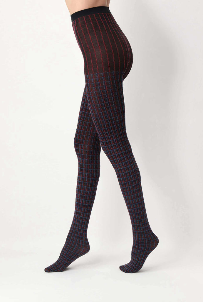 Side view of lady's legs, wearing check navy and red tights.