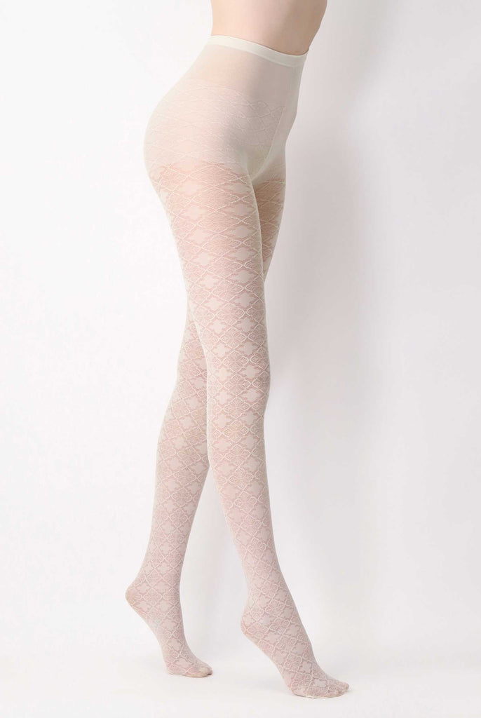 Side view of lady's legs wearing cream jacquard lace tights.