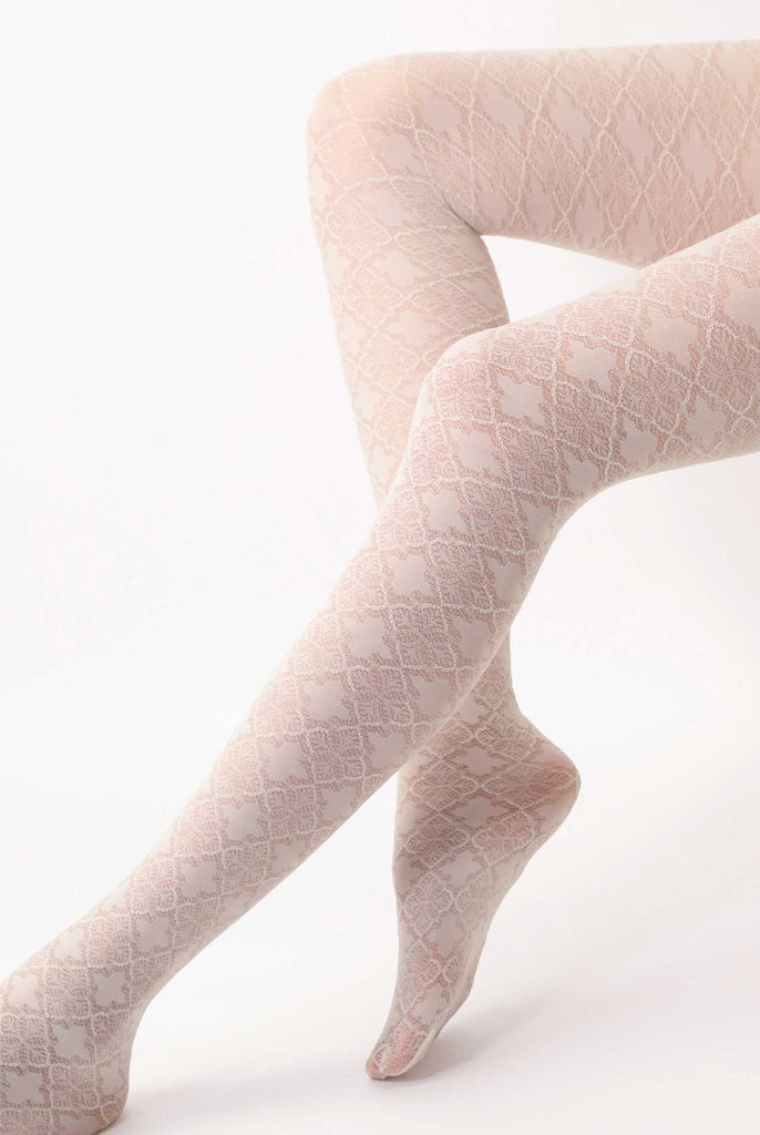 Lady's lower legs wearing patterned cream tights.