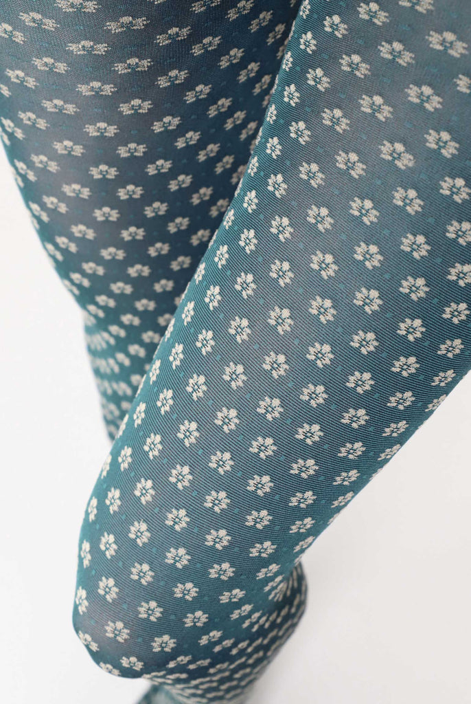 Close up of lady's upper legs wearing green floral tights.