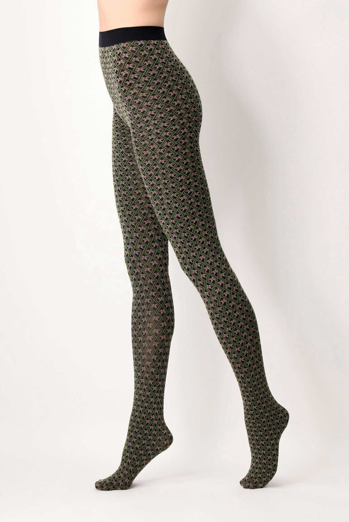 Side view of lady's legs, wearing green and peony pink  motif pattern tights.