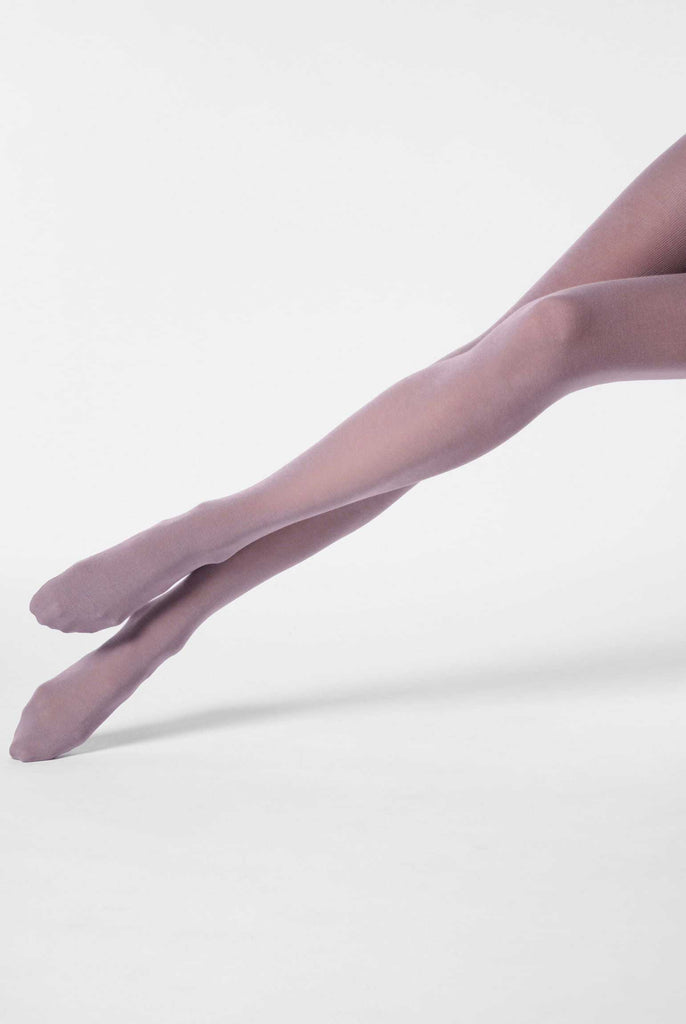 lady's legs outstretched  in lilac coloured tights.