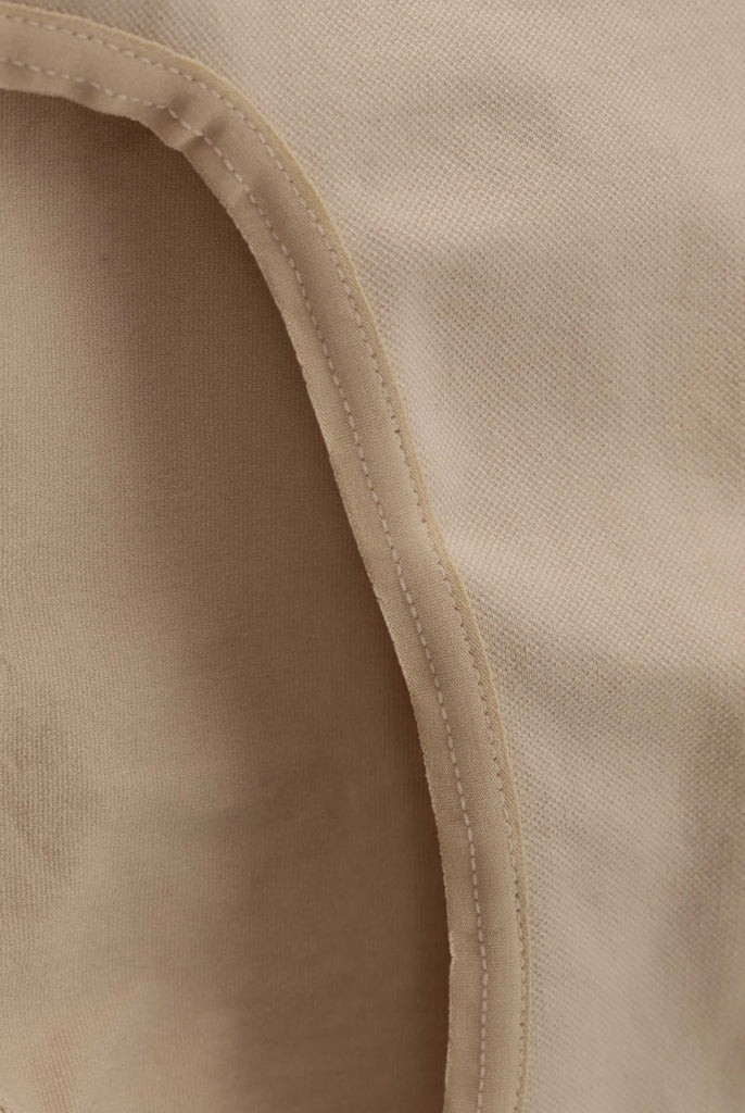 Close up of side seams for ladies skin coloured underpants.