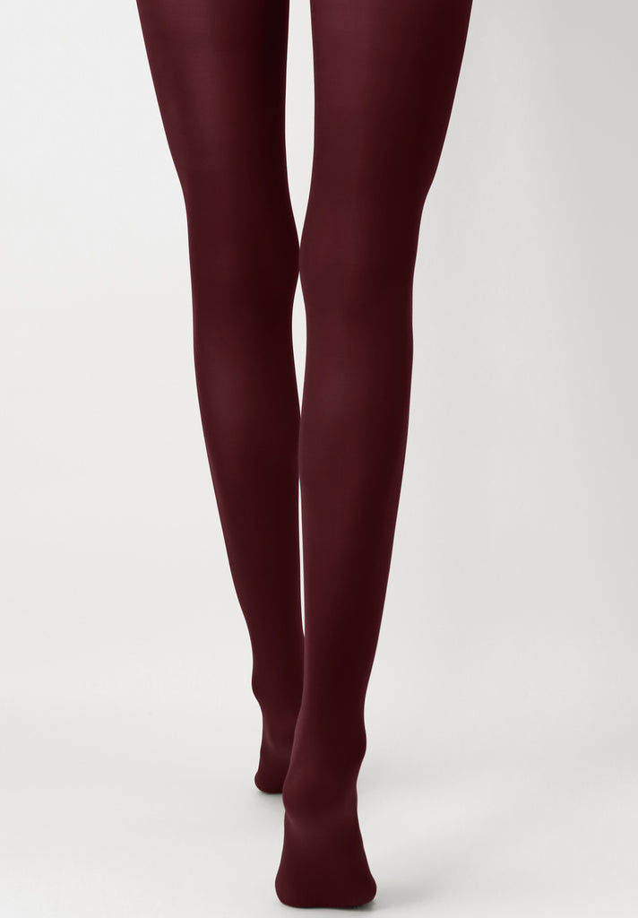 Back view of lady's legs wearing dark red tights.
