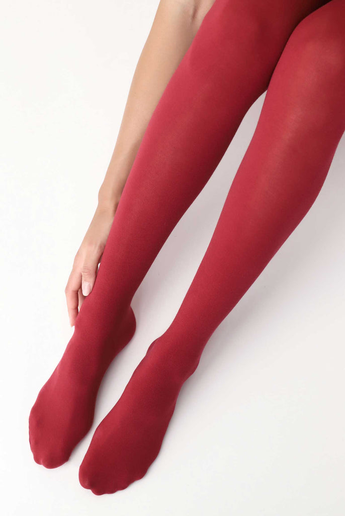 Front view of lady's feet and lower legs in red tights.