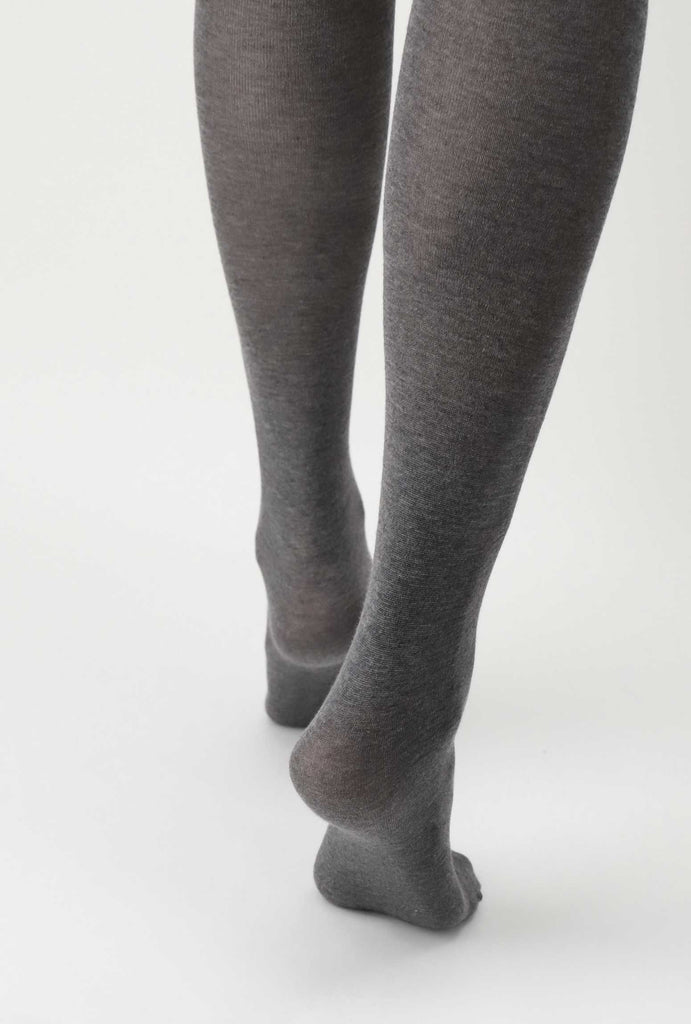 Back view of lady's lower legs wearing grey melange tights.