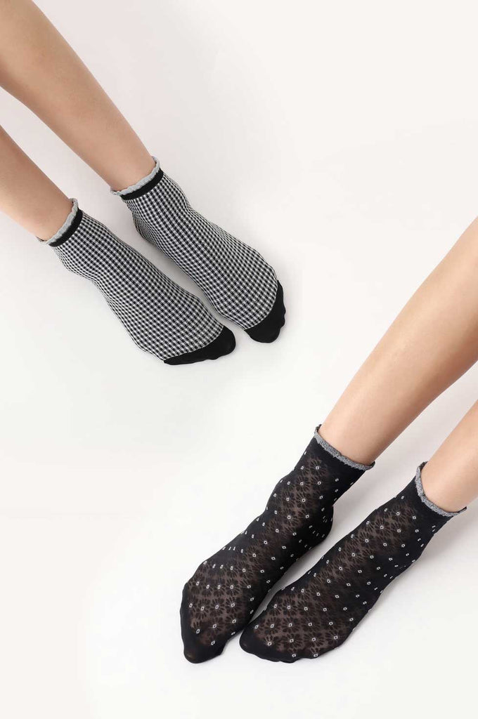 Two images of ladies' feet wearing black, patterned, ankle socks.