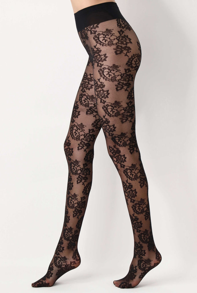 Side view of lady's legs in black floral, sheer tights.