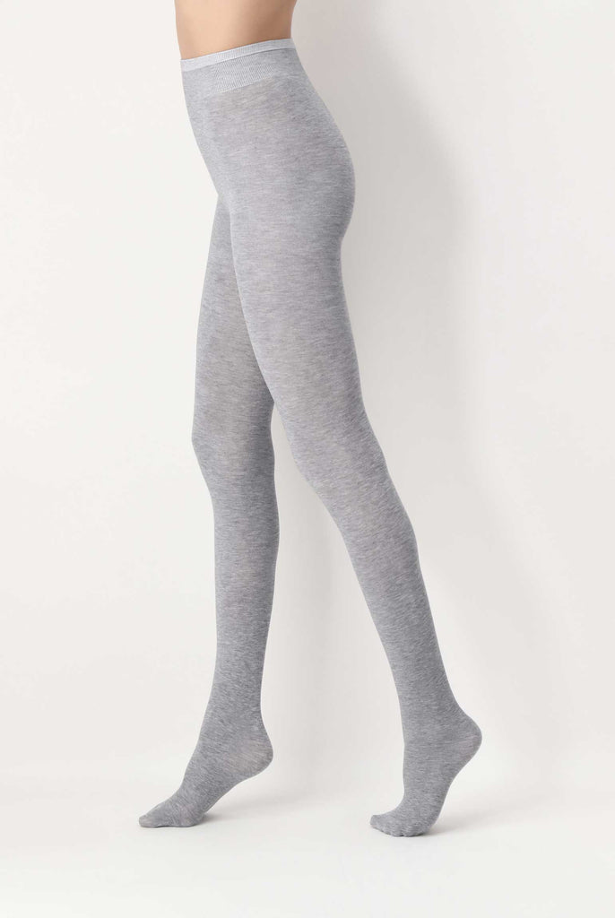 Side view of lady's legs in light grey tights.