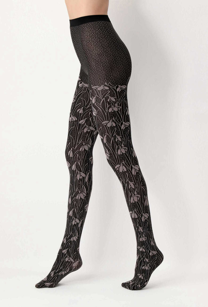 Side view of lady's legs wearing black and grey floral tights.