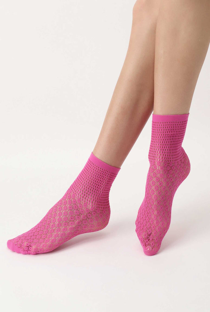 Lady's feet modelling, pink, patterned mesh socks.