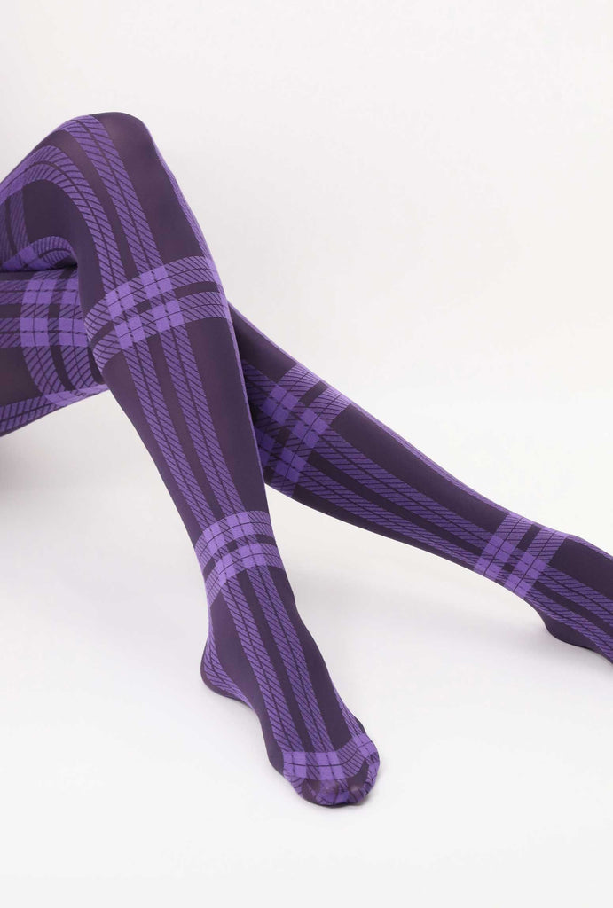 Lady's lower legs extended, wearing purple plaid tights.