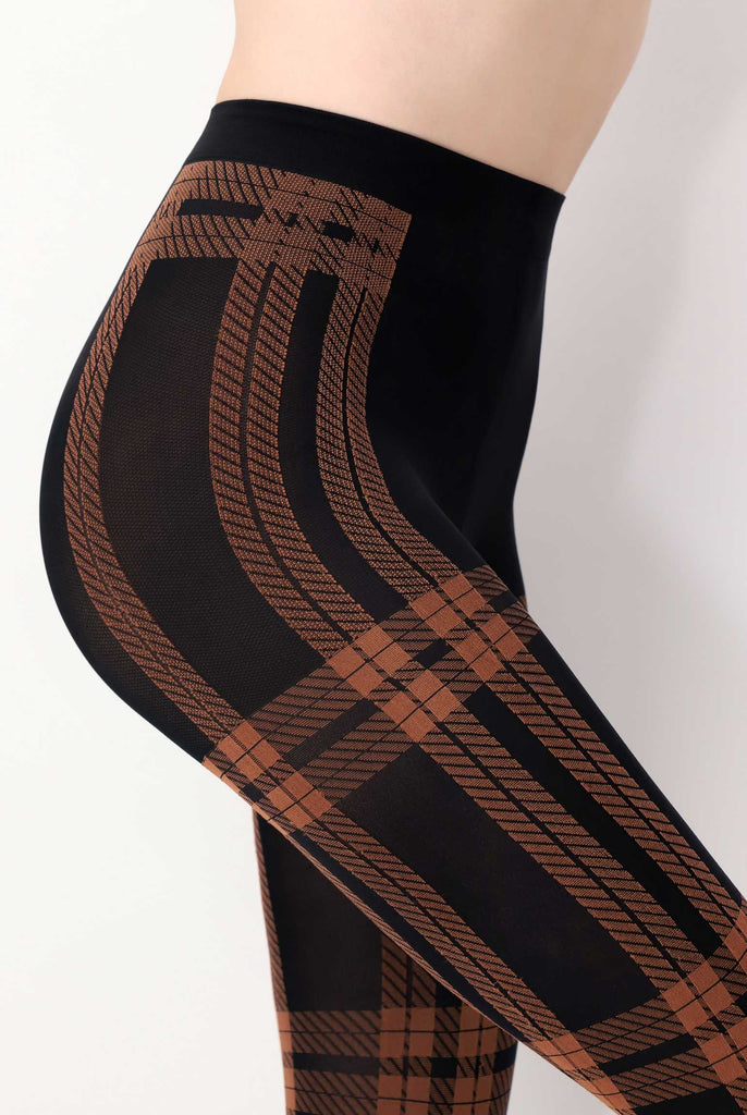 Side view of lady's abdomen, wearing black and orange check tights.