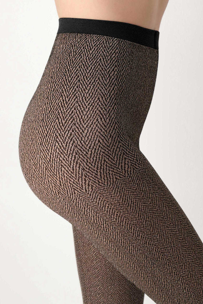 Close up of lady's abdomen wearing brown tweed tights.
