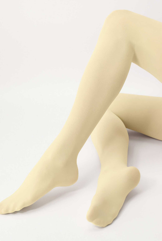 view of lady's lower legs, raised and stretched in vanilla coloured tights.