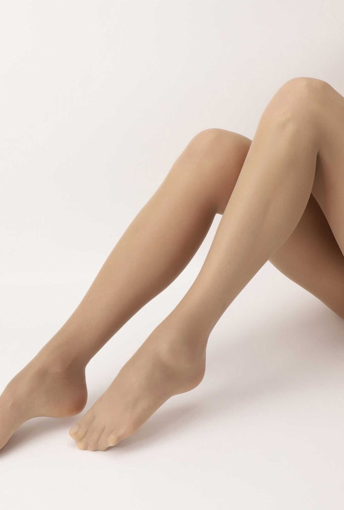 Side view of lady's lower legs wearing nude coloured tights.