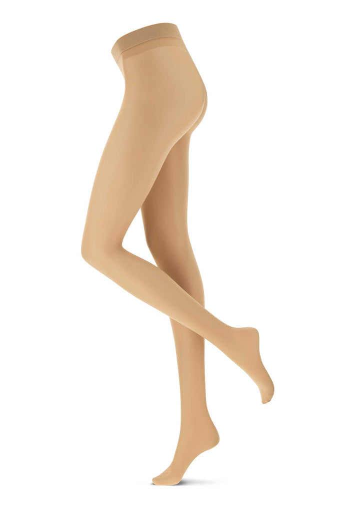 Side view of lady's legs, standing in nude coloured tights.