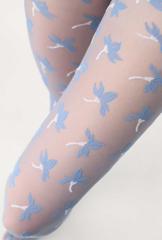 Close up of lady's upper thigh, wearing light blue, sheer floral pattern tights.
