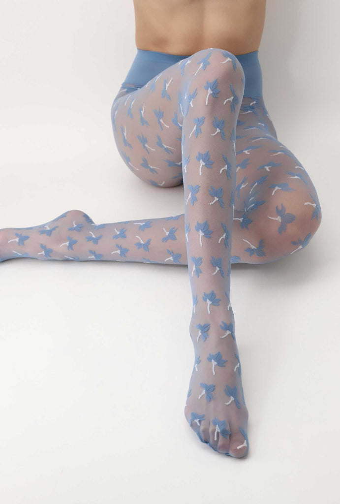 Lady's legs in sitting position, wearing light blue floral patterned sheer tights.