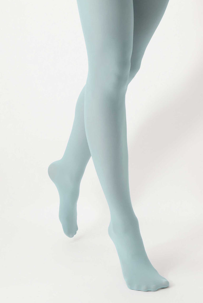 Front view of lady's lower lers walking and wearing teal blue tights.