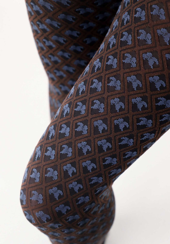 Close up of lady's knee, wearing motif blue and brown pattern tights.