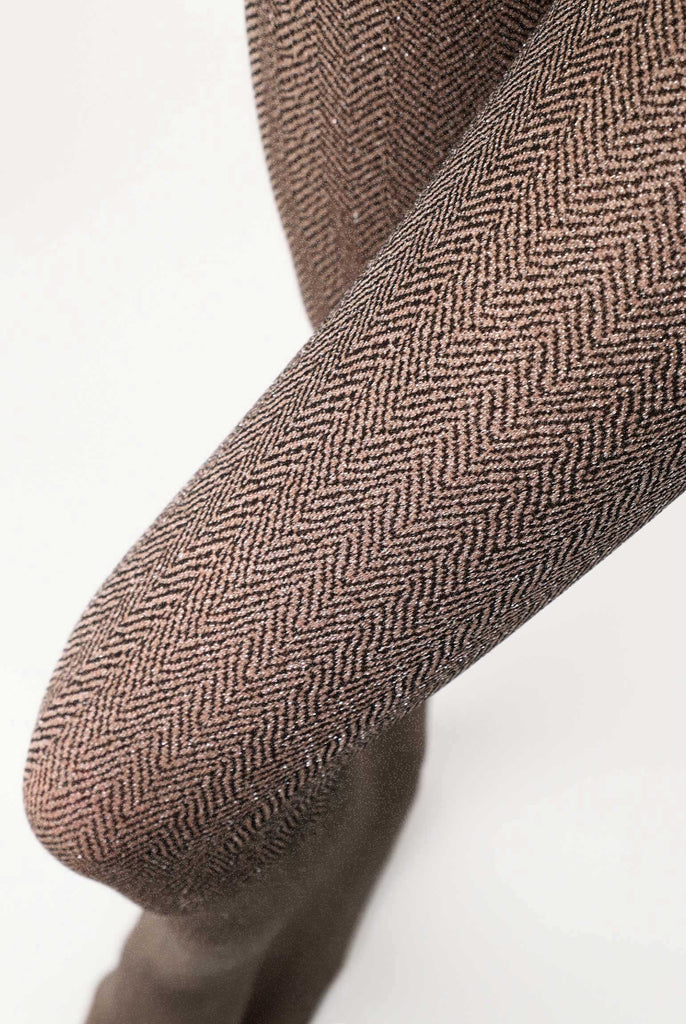 Close up of lady's legs wearing brown tweed tights.