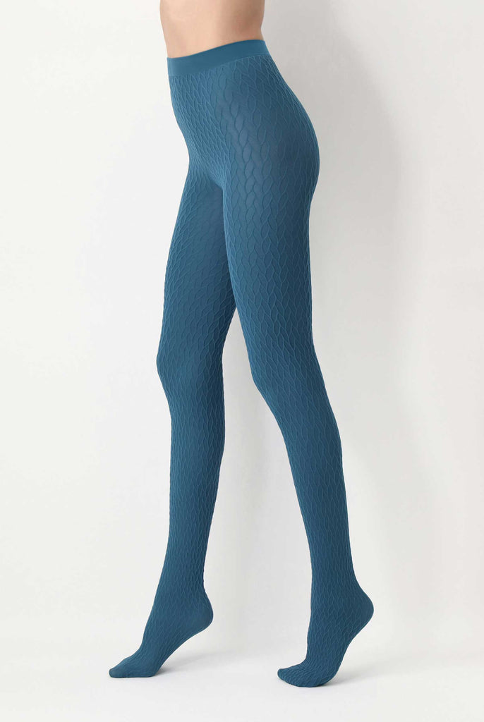 Side view of lady's legs in walking stance, wearing cobalt green tights.