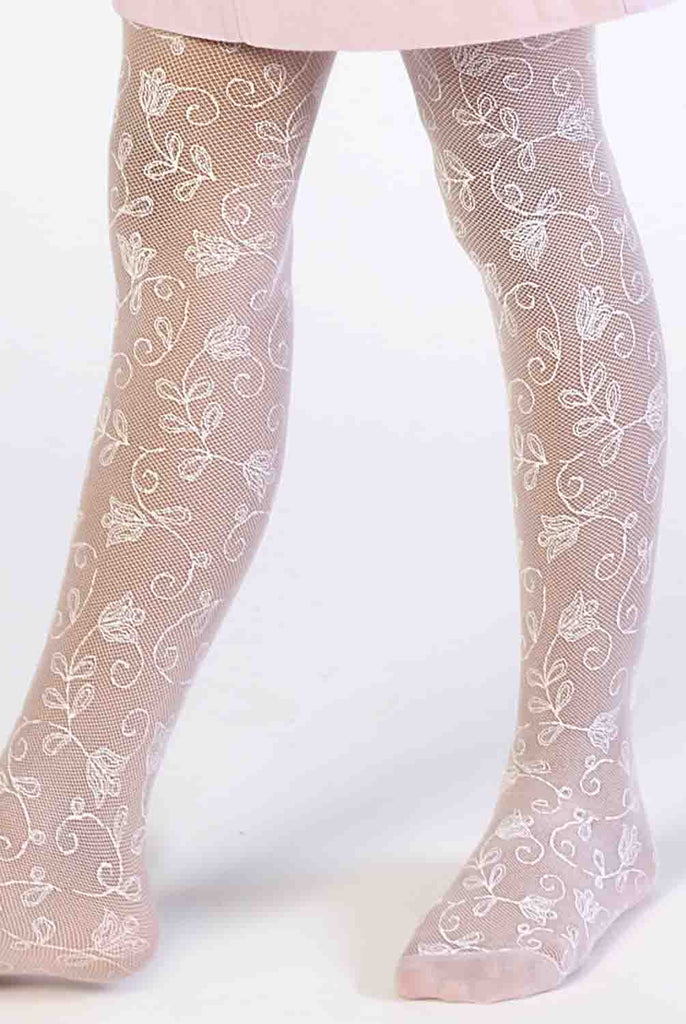 Close-up of girl's legs wearing, white floral lace tights.