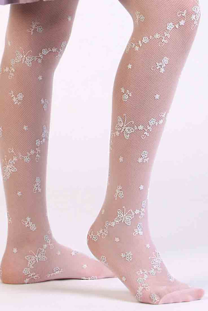 Close-up of a child's legs wearing white butterfly, floral mesh tights.