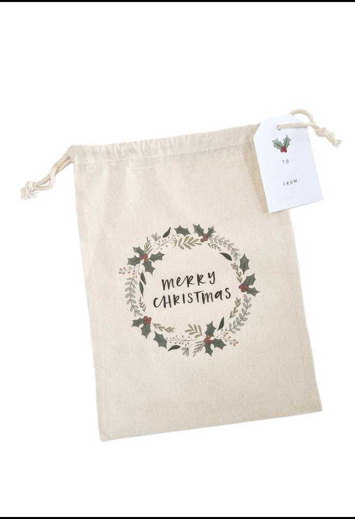 Christmas canvas gift bag with drawstrings and Merry Christmas greeting.