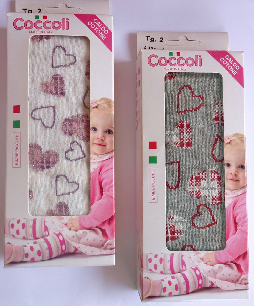 Two boxes of Coccoli heart patterned white and grey tights.