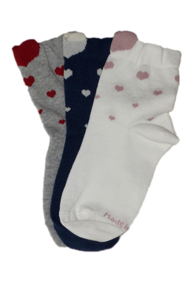Three pairs of overlapping Coccoli girls' heart pattern socks.