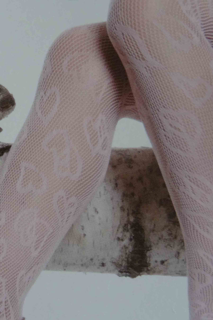 Close up of girls knees and lower legs wearing micro mesh tights.