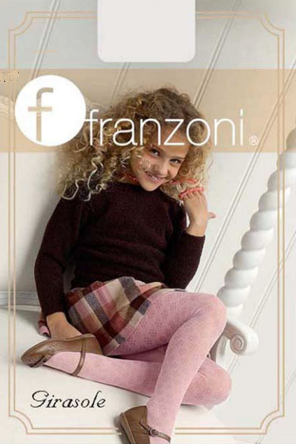 Young smiling girl sitting in a big white wooden chair wearing a black skivvy, check skirt and rose pink tights.