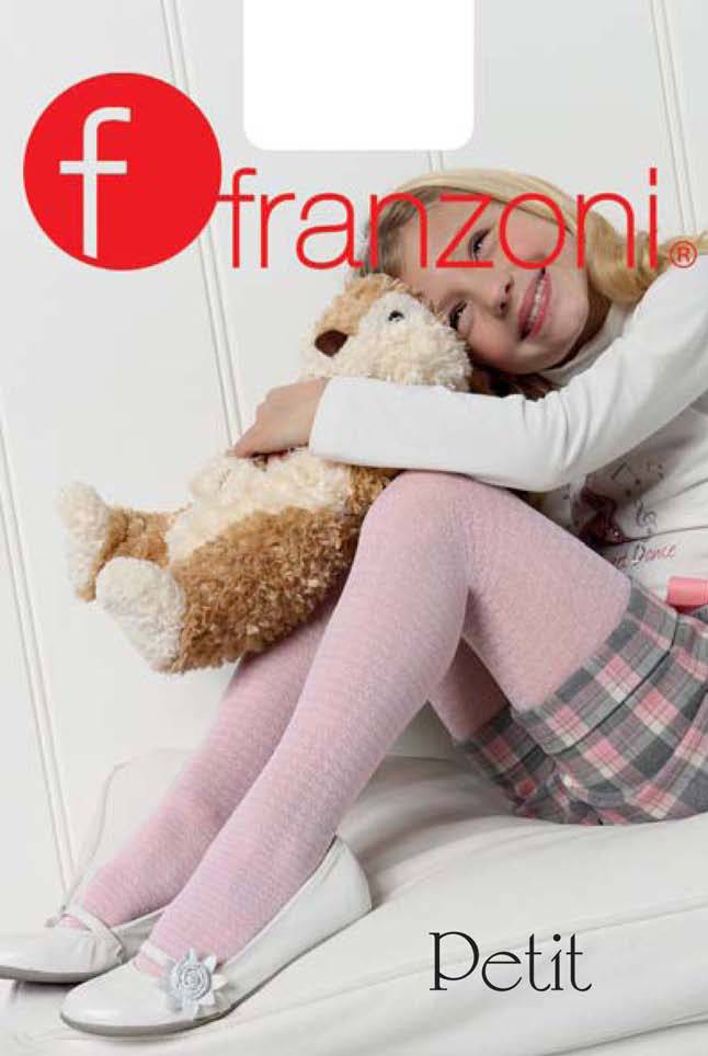 Girl sitting with knees up arm resting on her knees, hugging light brown and cream dog soft toy. 