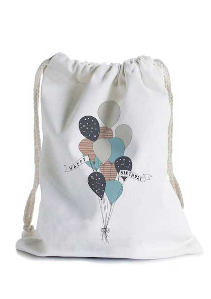 White, drawstring bag with image of balloons and Happy Birthday message printed on the front.
