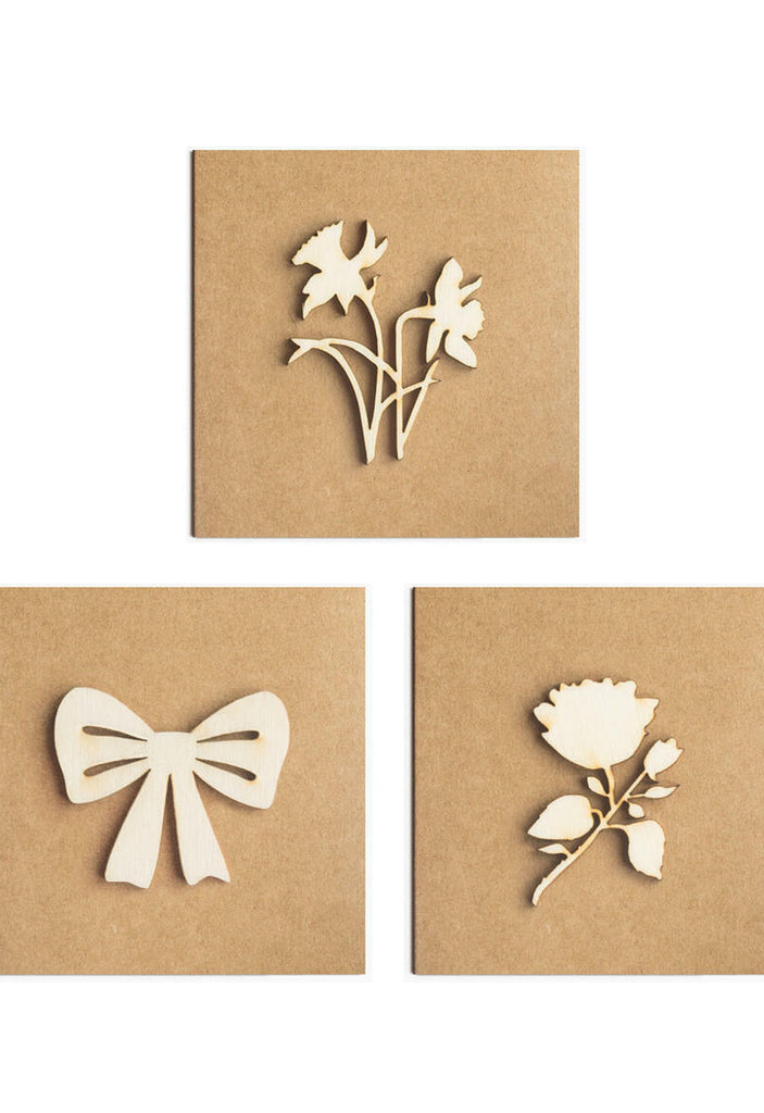 Three mini gift cards on brown card depicting, daffodils, bow & rose.