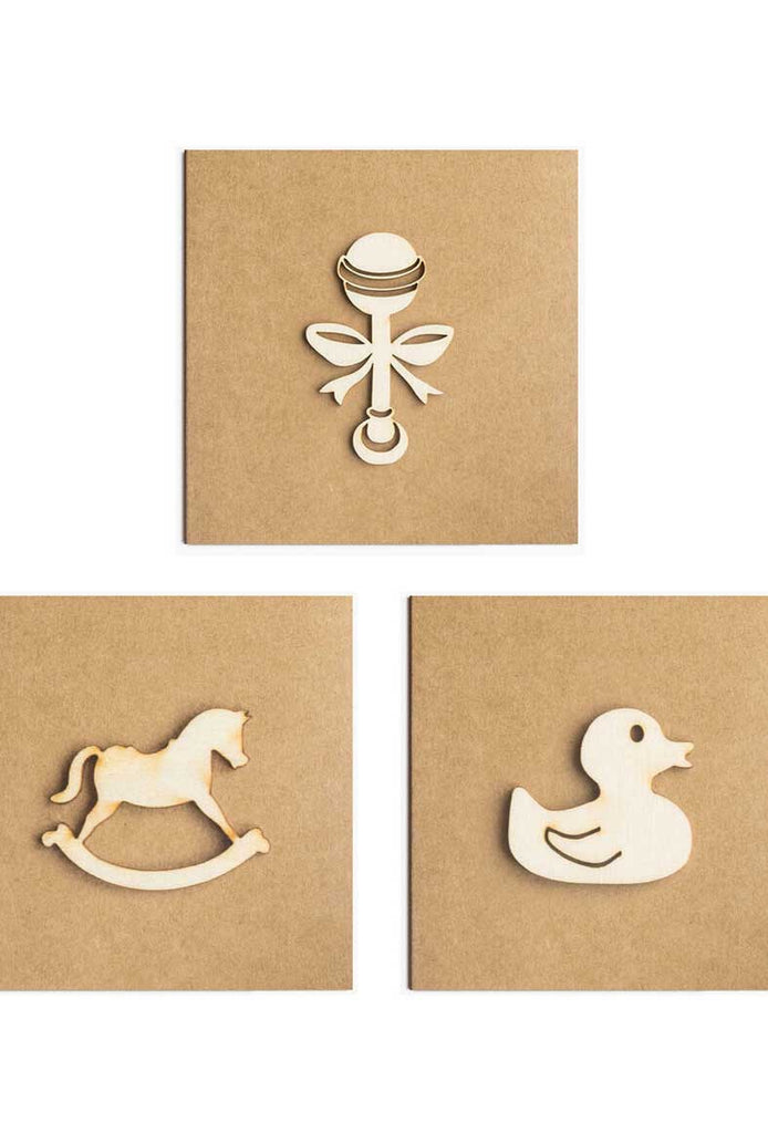 Three kraft paper gift cards decorated with wooden baby items.