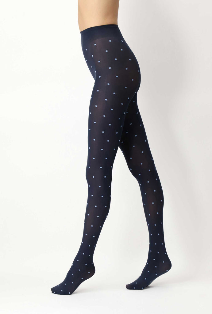 Lady's legs in walking position in black tights with sky blue spots.
